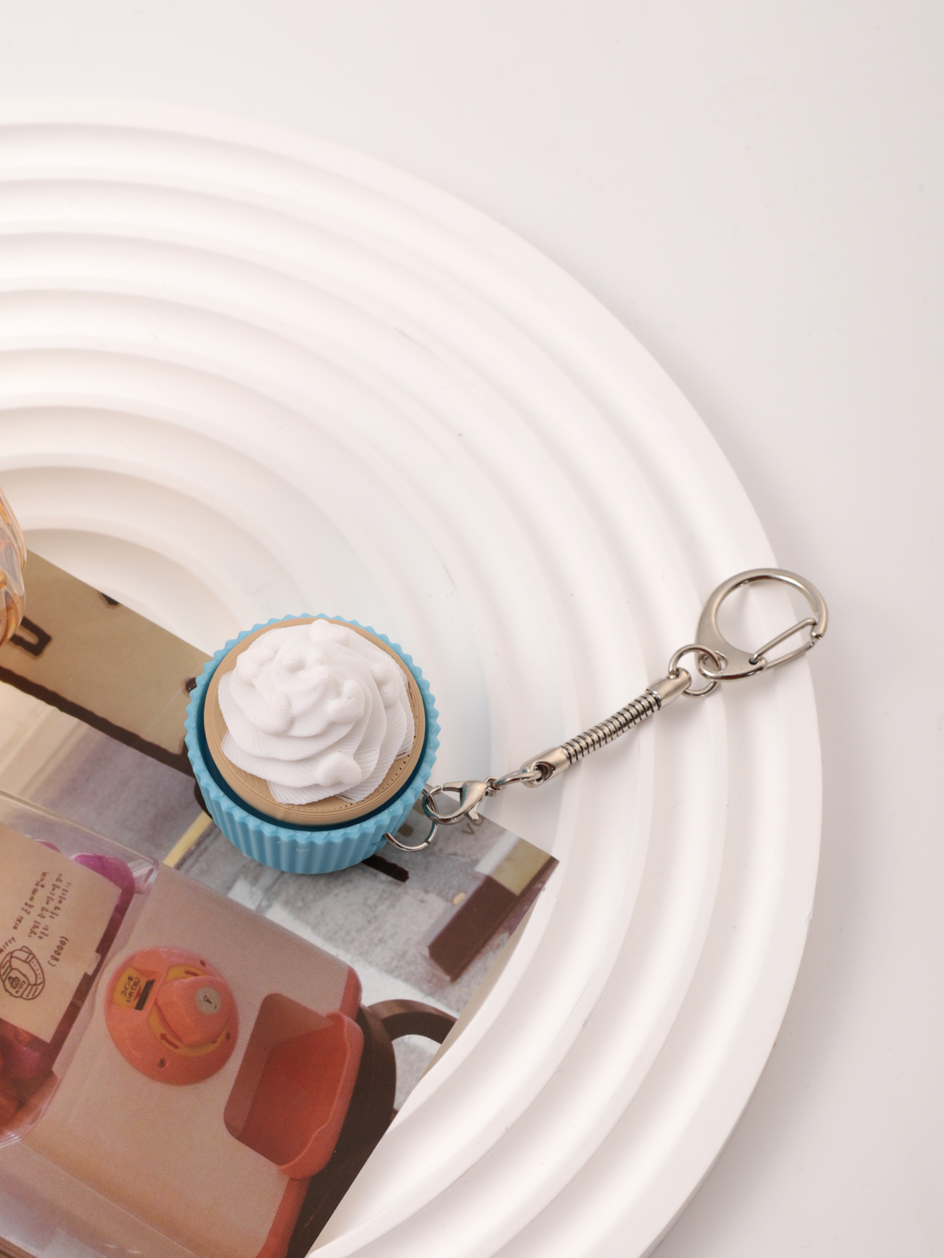 3D printed cupcake-shaped keychain - an adult stress relief toy with a portable anxiety-reducing gadget featuring a clickable keyboard design
