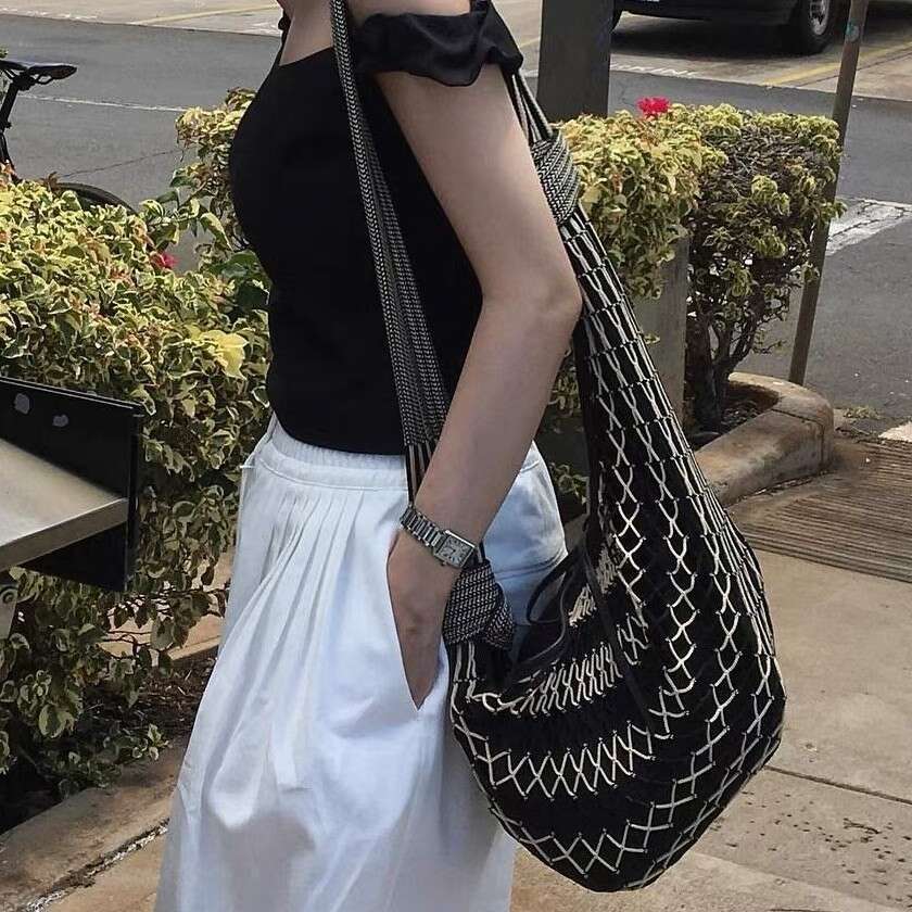 Designer Bag Tote Bag Designer Shoulder Contemporary Fashion Forward Messenger Style Satchel Featuring Distinctive Color Blocks and Horn Accents