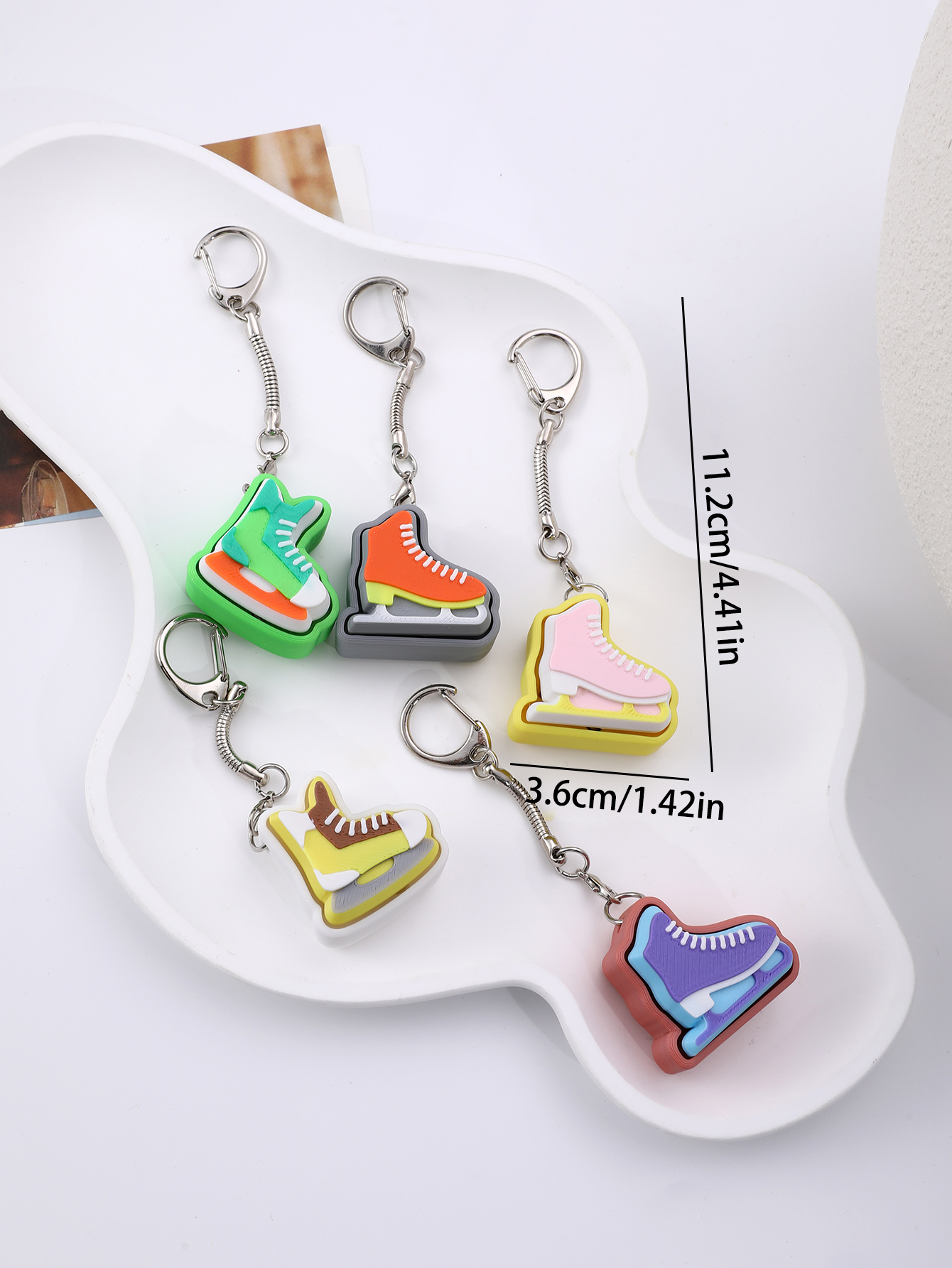 3D printed skating shoe-shaped keychain - an adult stress relief toy with a portable anxiety-reducing gadget featuring a clickable keyboard design