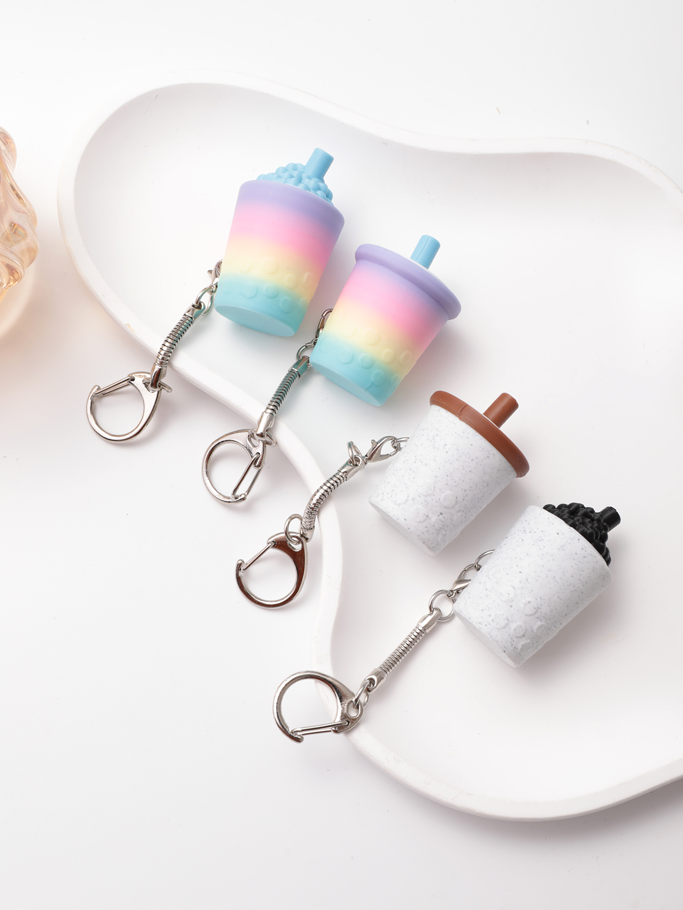 3D printed milk tea cup-shaped keychain - adult stress relief toy, with a portable anxiety relief gadget featuring a clickable keyboard design