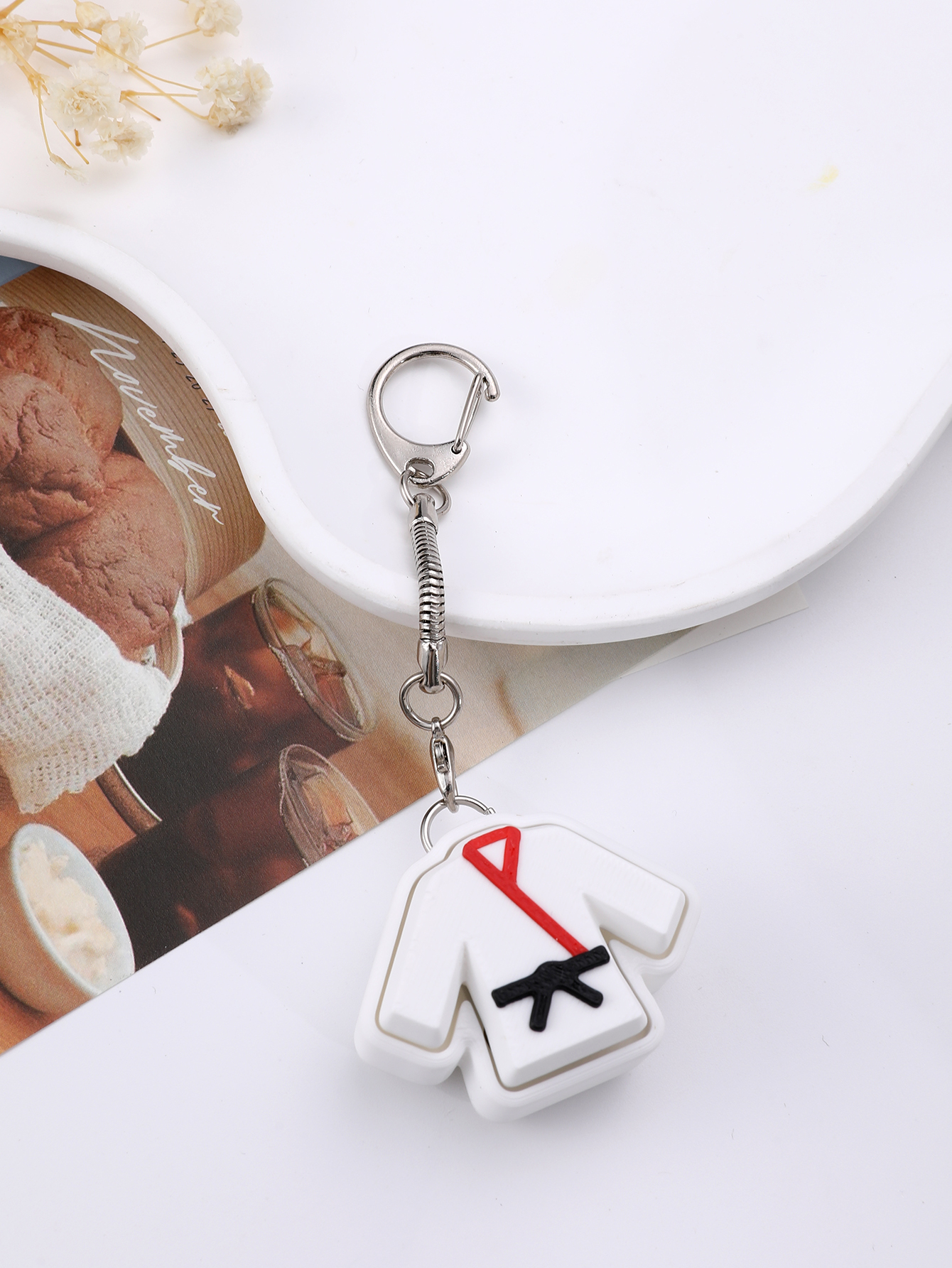 3D printed taekwondo uniform keychain - an adult stress relief toy with a portable anxiety-reducing gadget featuring a clickable keyboard design