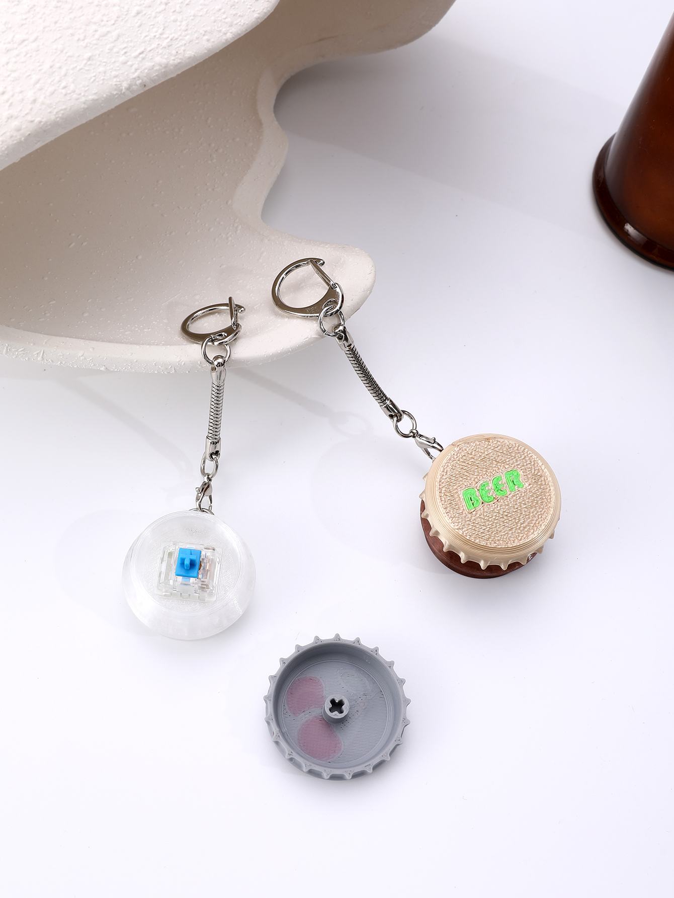 3D printed wine bottle cap keychain - adult stress relief toy, with a portable anxiety relief gadget featuring a clickable keyboard design