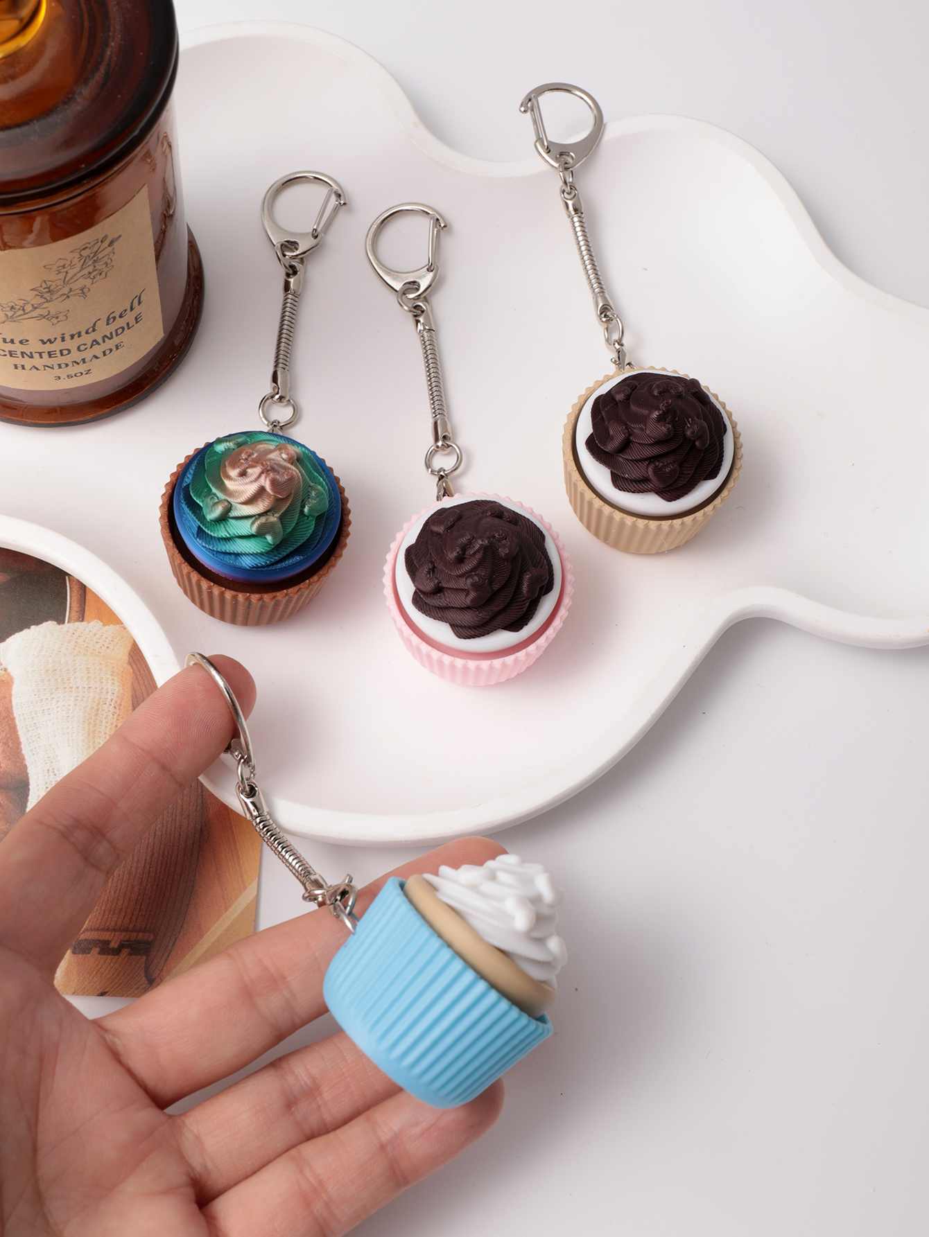 3D printed cupcake-shaped keychain - an adult stress relief toy with a portable anxiety-reducing gadget featuring a clickable keyboard design