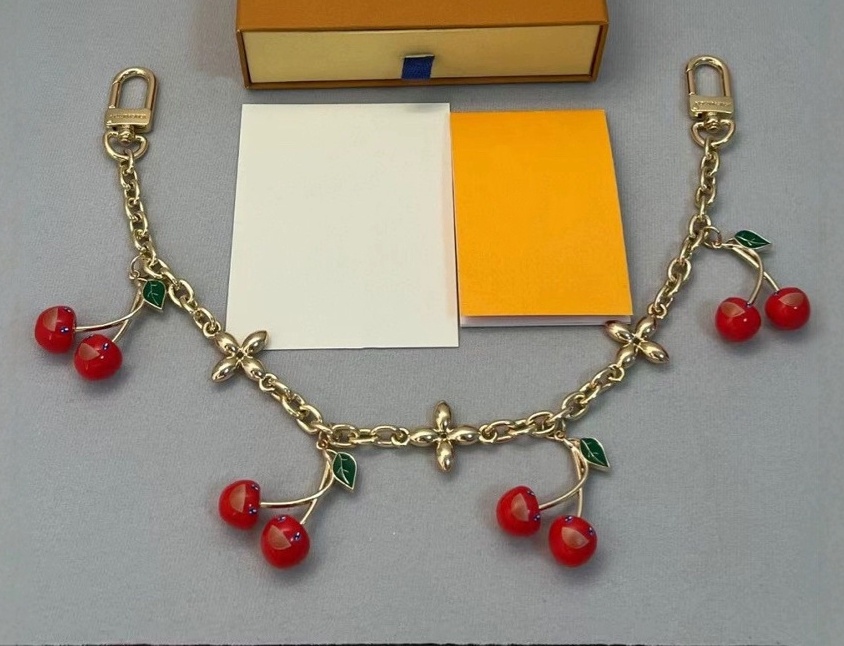 Luxurys keychain designer bag charm gold cherry chain flower Women Buckle jewelry Keyring Bag chain couple charm Car Key