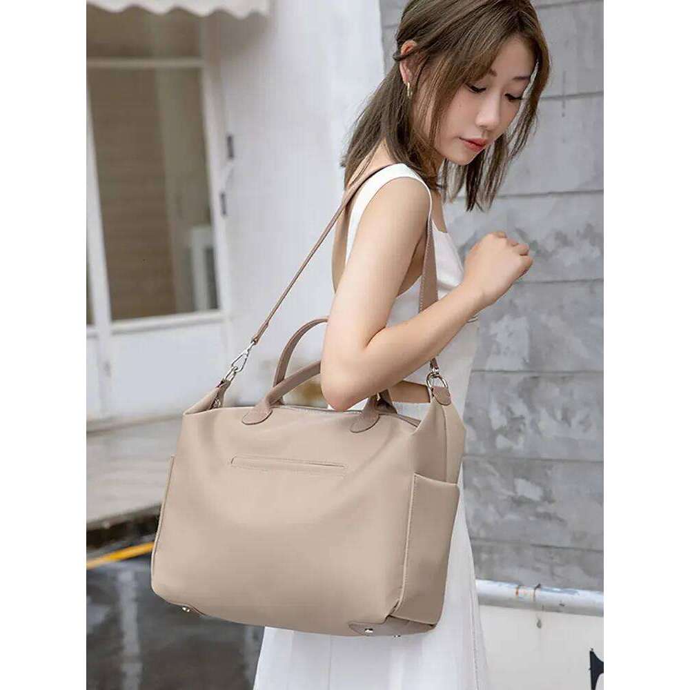 2025 New Ladies Handheld Tote Large Capaci Commuting Travel Ort Trip Busin Soft Ox Cloth Oulder Bag