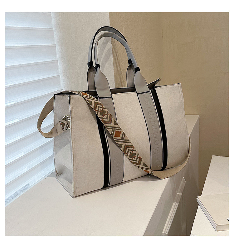 Large capacity hand-held canvas women's simple commuter tote with wide shoulder strap one-shoulder crossbody bag is versatile2025 TUES