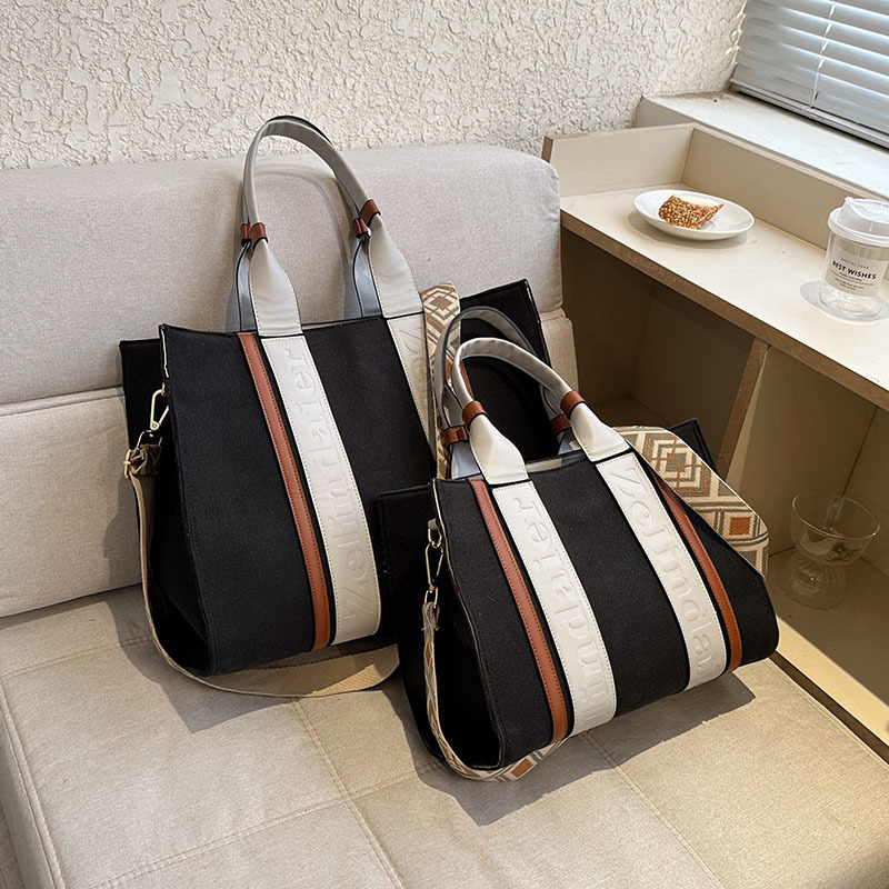 Large capacity hand-held canvas women's simple commuter tote with wide shoulder strap one-shoulder crossbody bag is versatile2025 TUES