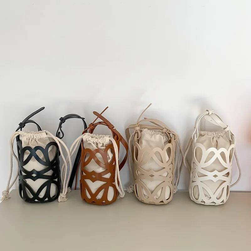 Hollowed Out Drawstring Bucket Bag Korea 2025 New Womens PU Splicing Canvas Shoulder Bag Fashion Versatile Mini Beach Bag