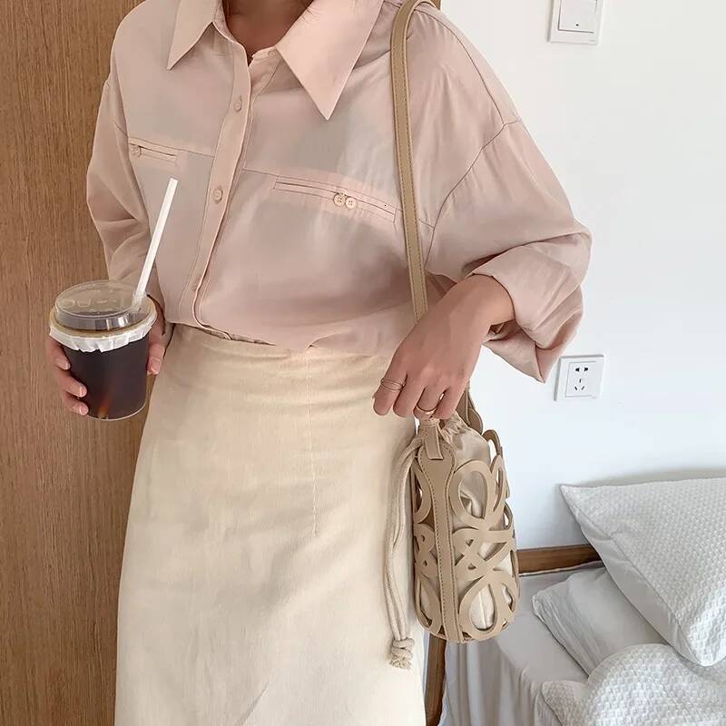 Hollowed Out Drawstring Bucket Bag Korea 2025 New Womens PU Splicing Canvas Shoulder Bag Fashion Versatile Mini Beach Bag