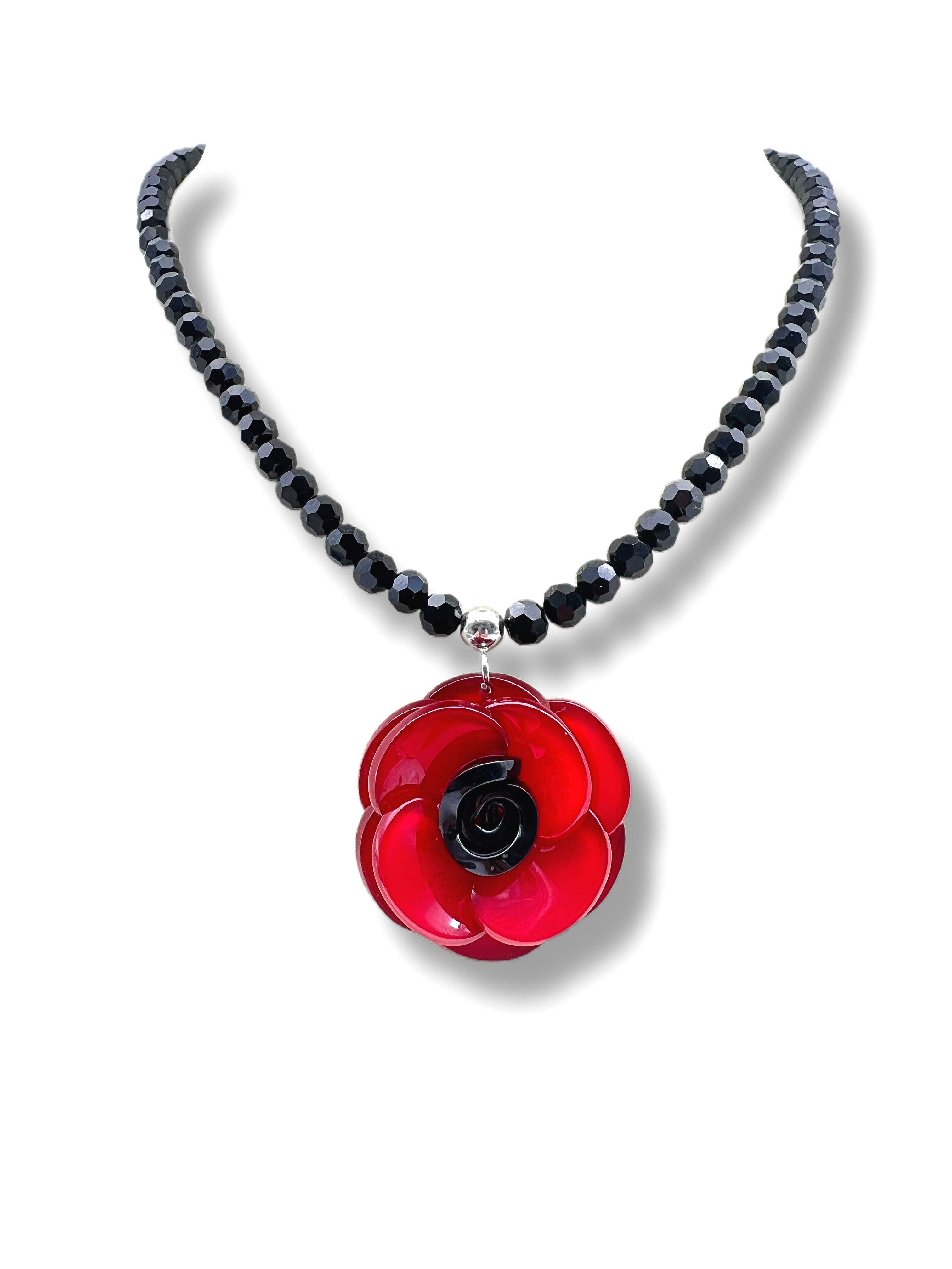 Elegant Black Beaded Necklace Featuring a Stunning Red Flower Charm