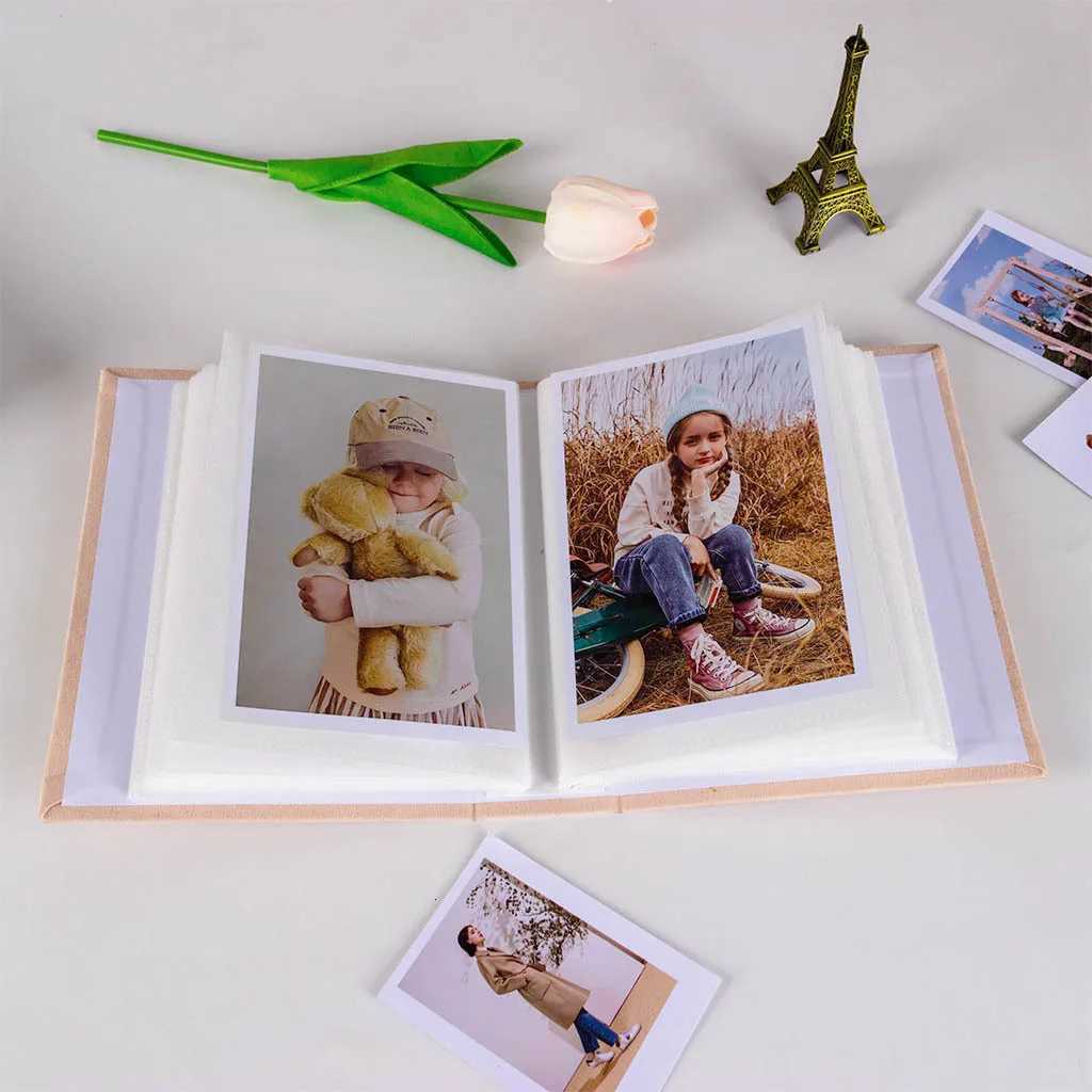 1 exquisite 6-inch fabric photo album with 100 pictures as a commemorative gift for friends and couples. Z250729
