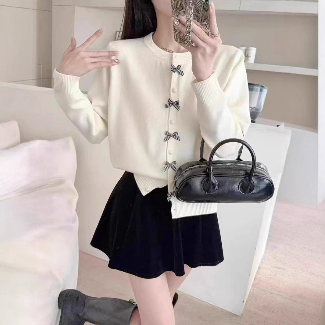 Korean-style soft knit sweater for women new autumn and winter bow button design age-reducing knit coat for women free shipping