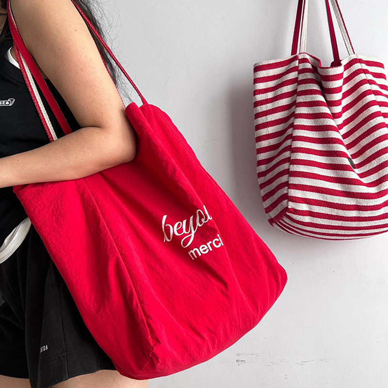 2025 Summer Vitality Striped Women's Canvas Bag New Double sided Shoulder Bag Korean Single Shoulder Diagonal Cross Bag Designer Bag