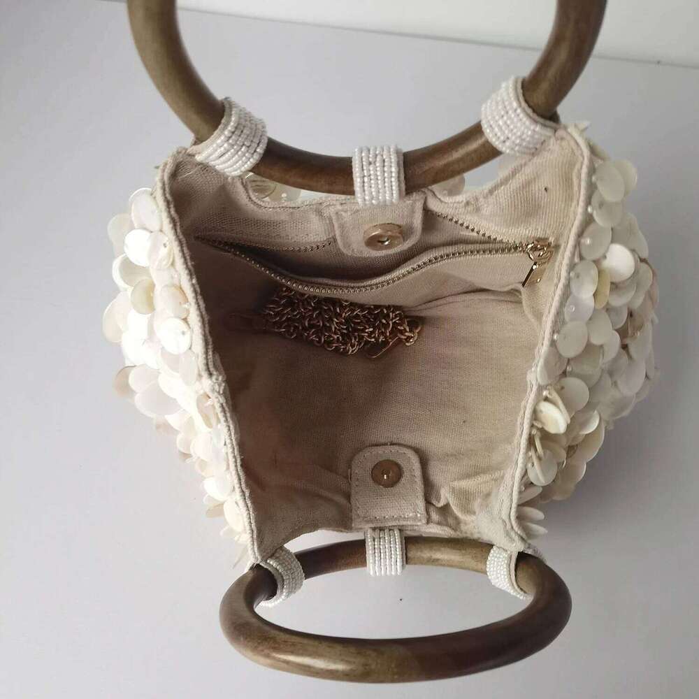 New high-end pure handmade natural shell fairy handbag women's niche subsourcing personalized trendy bag double-sided