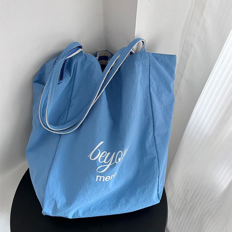 2025 Summer Vitality Striped Women's Canvas Bag New Double sided Shoulder Bag Korean Single Shoulder Diagonal Cross Bag Designer Bag