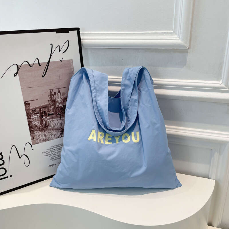 New Niche Alphabet Print Shoulder Large Capacity Designer Versatile Canvas Bag for Women Trendy Shopping Tote