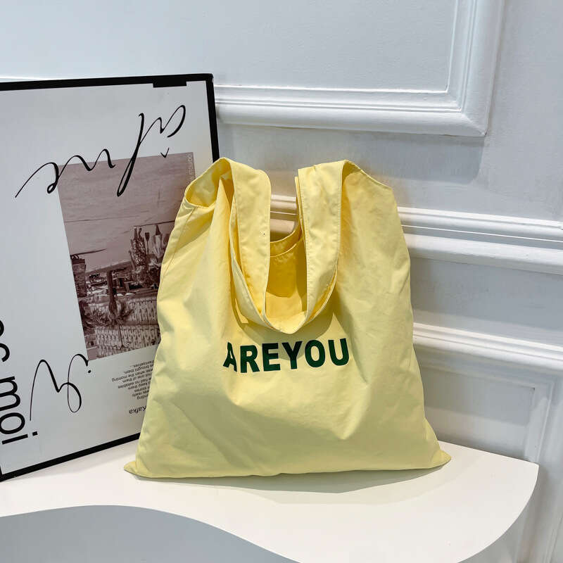 New Niche Alphabet Print Shoulder Large Capacity Designer Versatile Canvas Bag for Women Trendy Shopping Tote