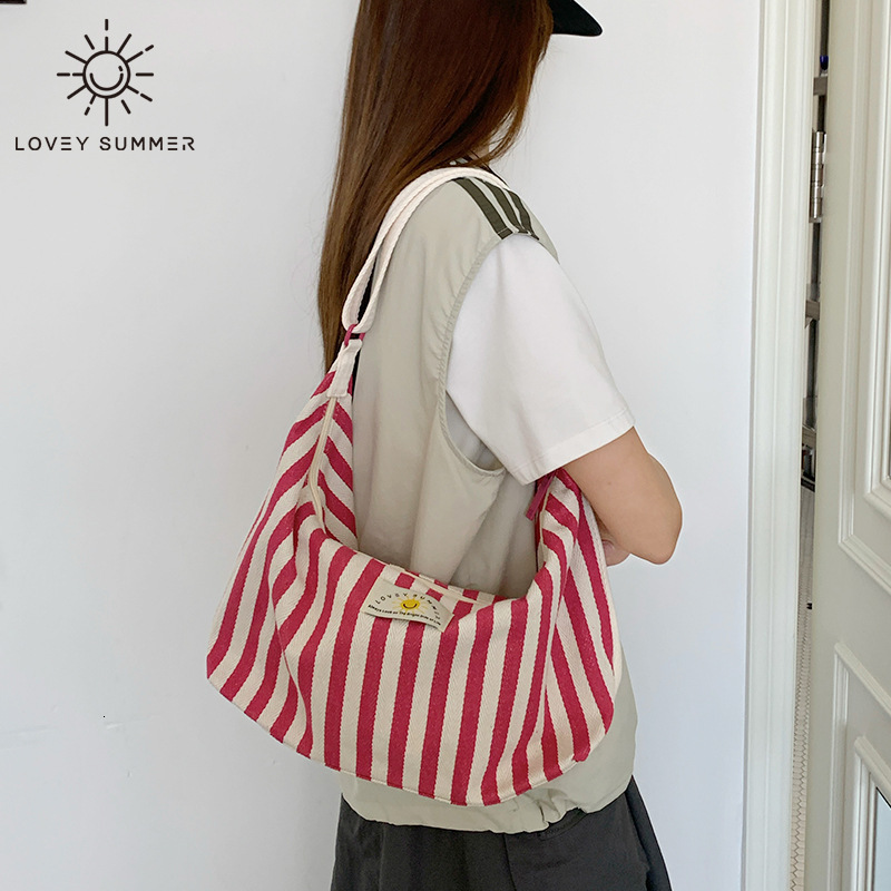 2025 designer's new Korean striped single shoulder women's crossbody bag, armpit handbag, commuting canvas bag