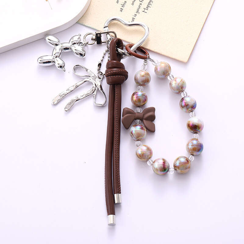 New Ins Acrylic Bird's Nest Beaded Phone Pendant Fashionable High-end PU Leather Rope Bowknot Hanging Decoration