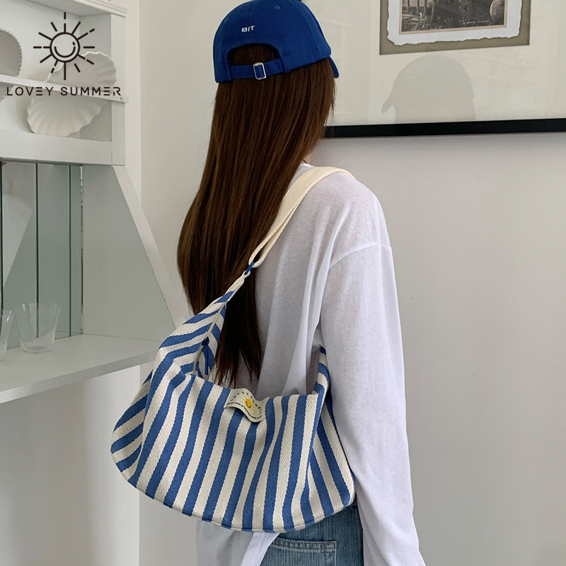 2025 designer's new Korean striped single shoulder women's crossbody bag, armpit handbag, commuting canvas bag
