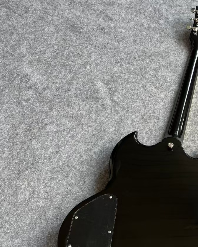 A black electric guitar. Customization is available; feel free to inquire about custom guitars with pictures.