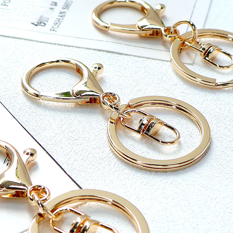 Zinc alloy lobster buckle bag hanging buckle keychain accessories DIY creative cartoon doll gift keychain gold color