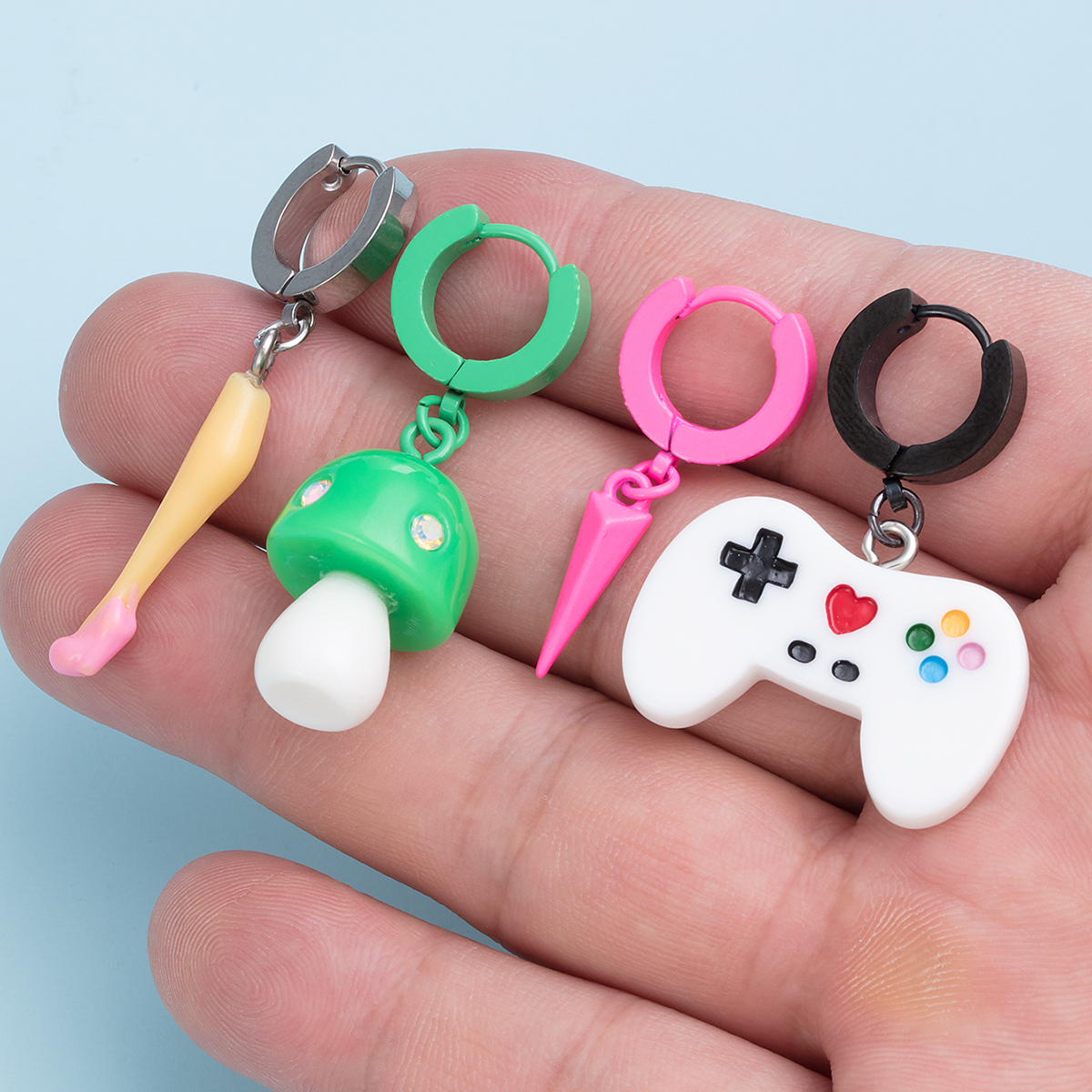 Stainless steel exaggerated personality ear bone nail pointed cone earrings mushroom game controller earrings human puncture jewelry wholesale