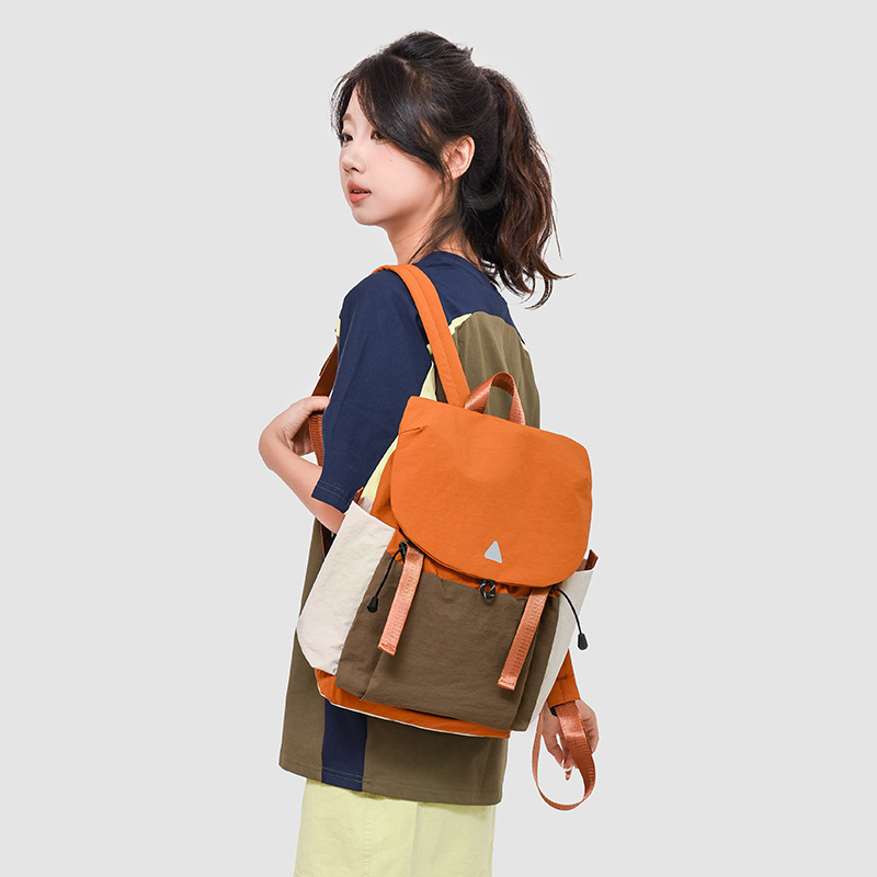 Summer new color blocked women's outdoor camping backpack, lightweight and large capacity waterproof hiking and mountaineering lightweight backpa