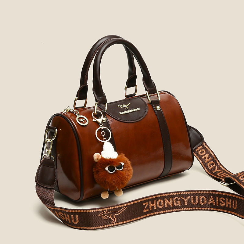 2025 Designer's New Women's Handbag Multi functional Fashion Boston Bag Tongqin Crossbody Bag