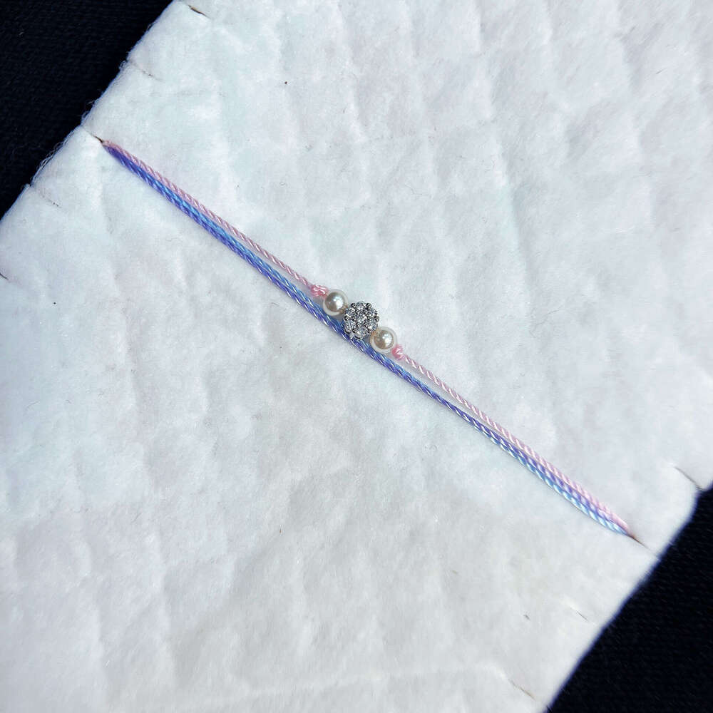 French Paris Fashion New Pearl Small Flower Inlaid Dia Three-Layer Woven Women's Bracelet Zodiac Year Lucky Trend