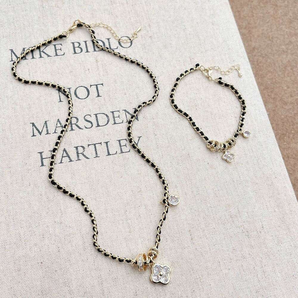 Xiaoxiangfeng Pointed Dia Four-Leaf Flower Black Gold Necklace for Women New Chinese Style Vintage Light Fashion High-End Braided Leather Rope 067