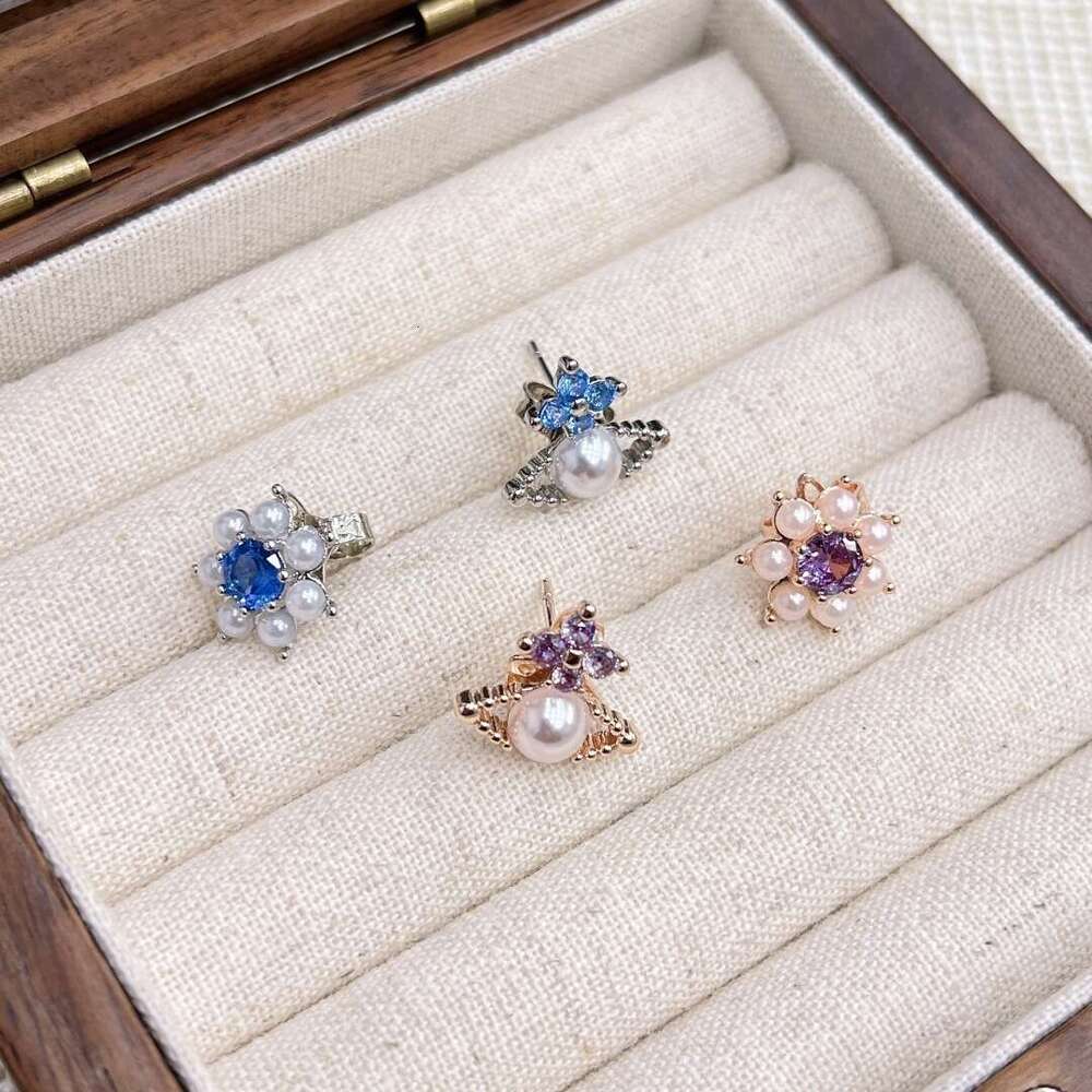 2025 New Western Empress Exquisite Versatile Saturn Pearl Flower Stud Earrings Light Niche Asymmetric Jewelry 0e7