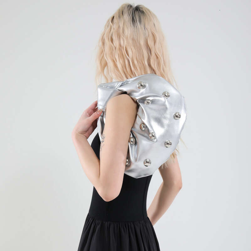 Handheld Dumpling for Women 2025 Summer New Hot Girl Niche Design Rivet Single Shoulder Underarm Bag