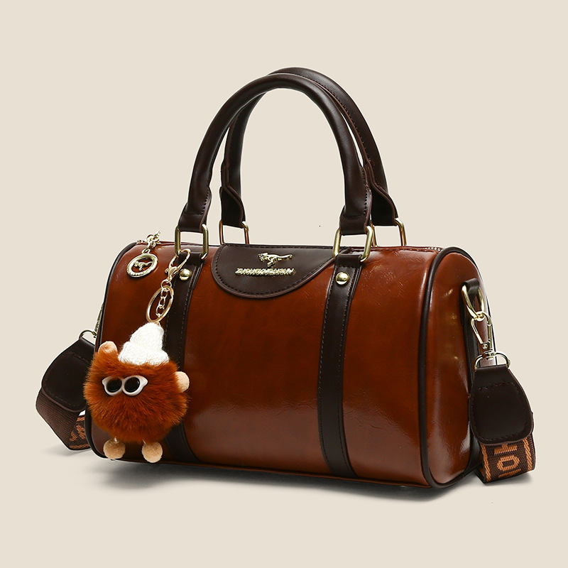 2025 Designer's New Women's Handbag Multi functional Fashion Boston Bag Tongqin Crossbody Bag