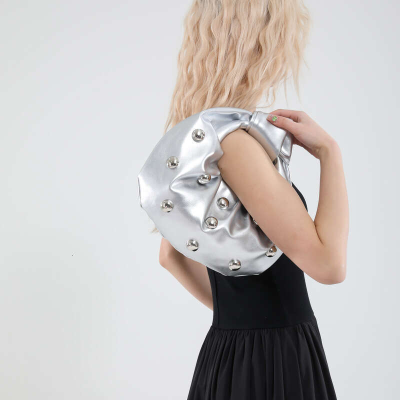 Handheld Dumpling for Women 2025 Summer New Hot Girl Niche Design Rivet Single Shoulder Underarm Bag
