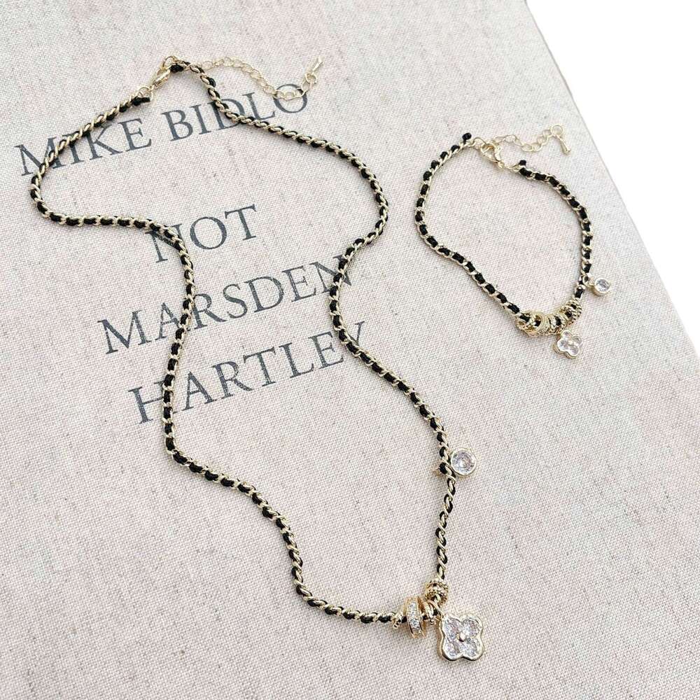 Xiaoxiangfeng Pointed Dia Four-Leaf Flower Black Gold Necklace for Women New Chinese Style Vintage Light Fashion High-End Braided Leather Rope 067