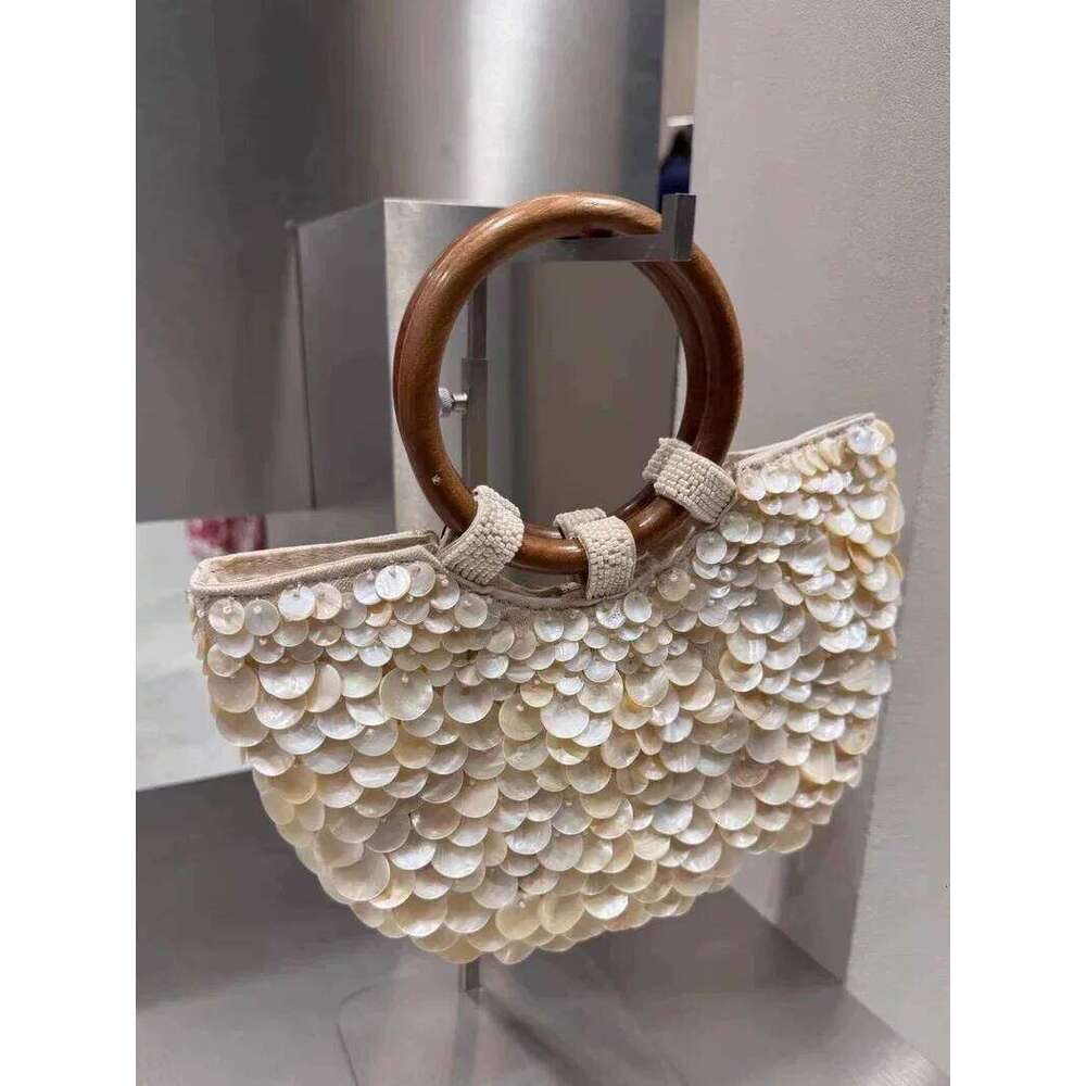 New high-end pure handmade natural shell fairy handbag women's niche subsourcing personalized trendy bag double-sided
