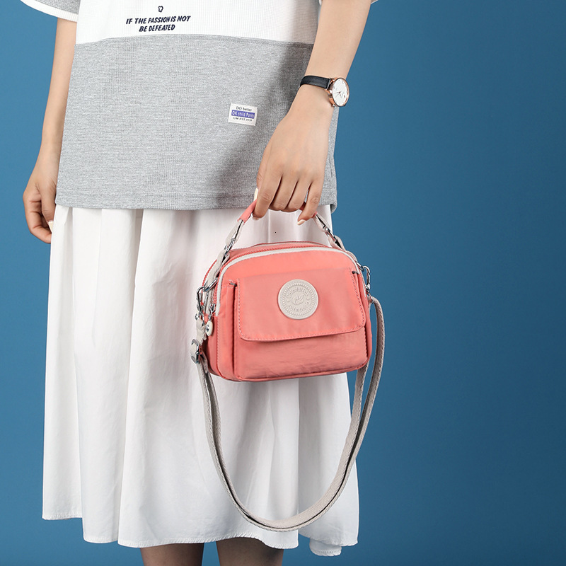 New Women's Fashion Trend Crossbody Simple Water-Resistant Bag Lipstick Coin Portable Handbag ddmymoon