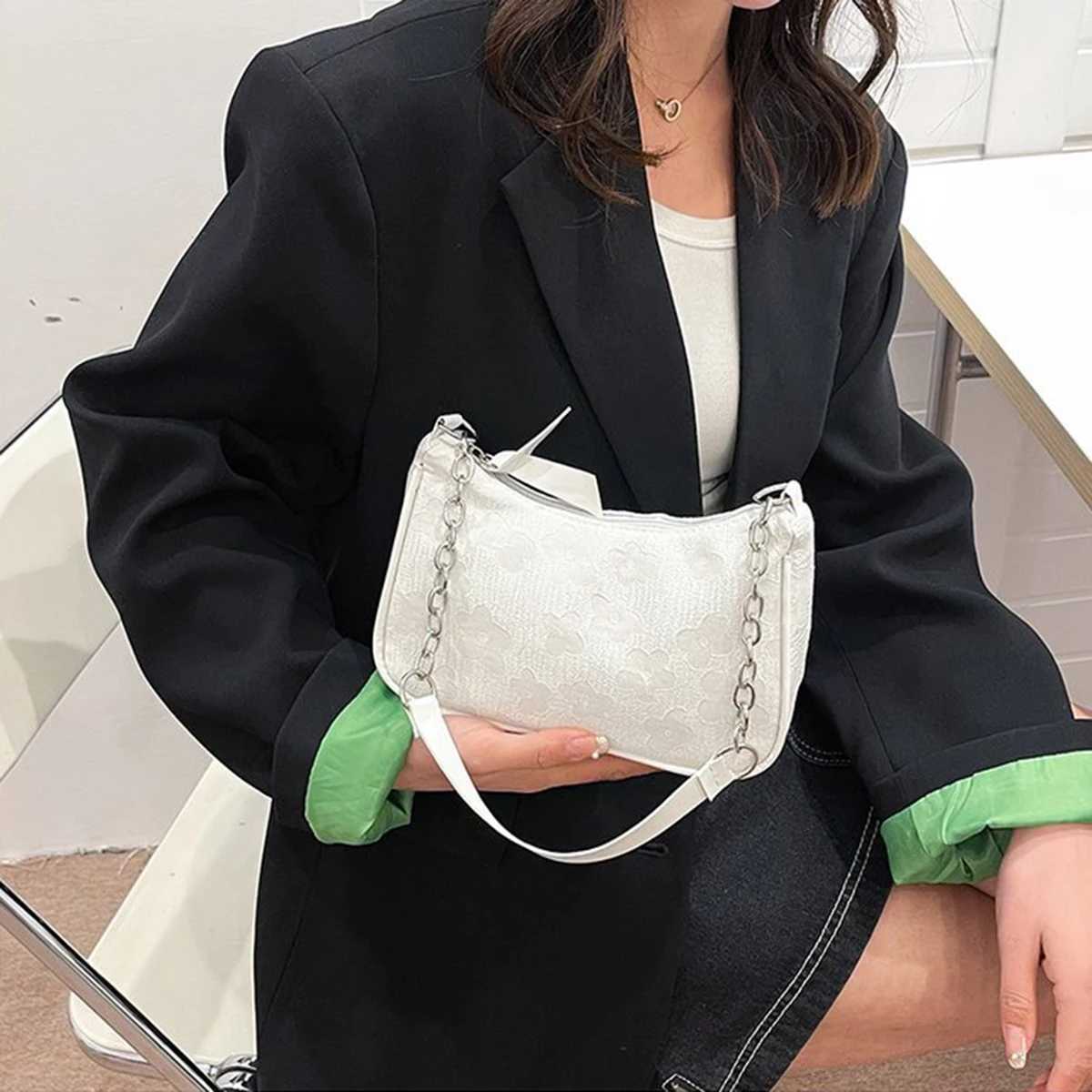 This white elegant and gentle chain underarm bag for women is foreign-style simple and a small square bag. Its a reliable a Y250730