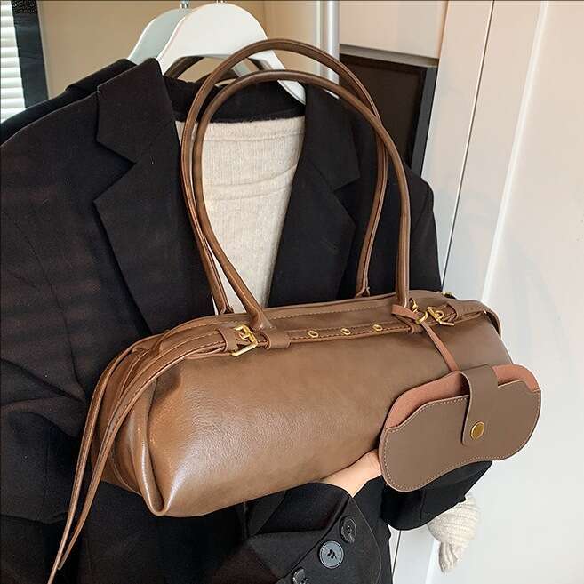 Brown leather hand-held cylindrical bag with metal decoration, single shoulder crossbody bag, fashionable and versatile, women's commuting bag
