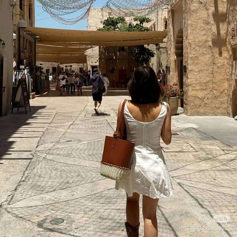 2025 Vacation Style Rattan Leather Splicing Bucket Trendy Designer Beach Handbags Brand Large Capacity Shoulder Bag