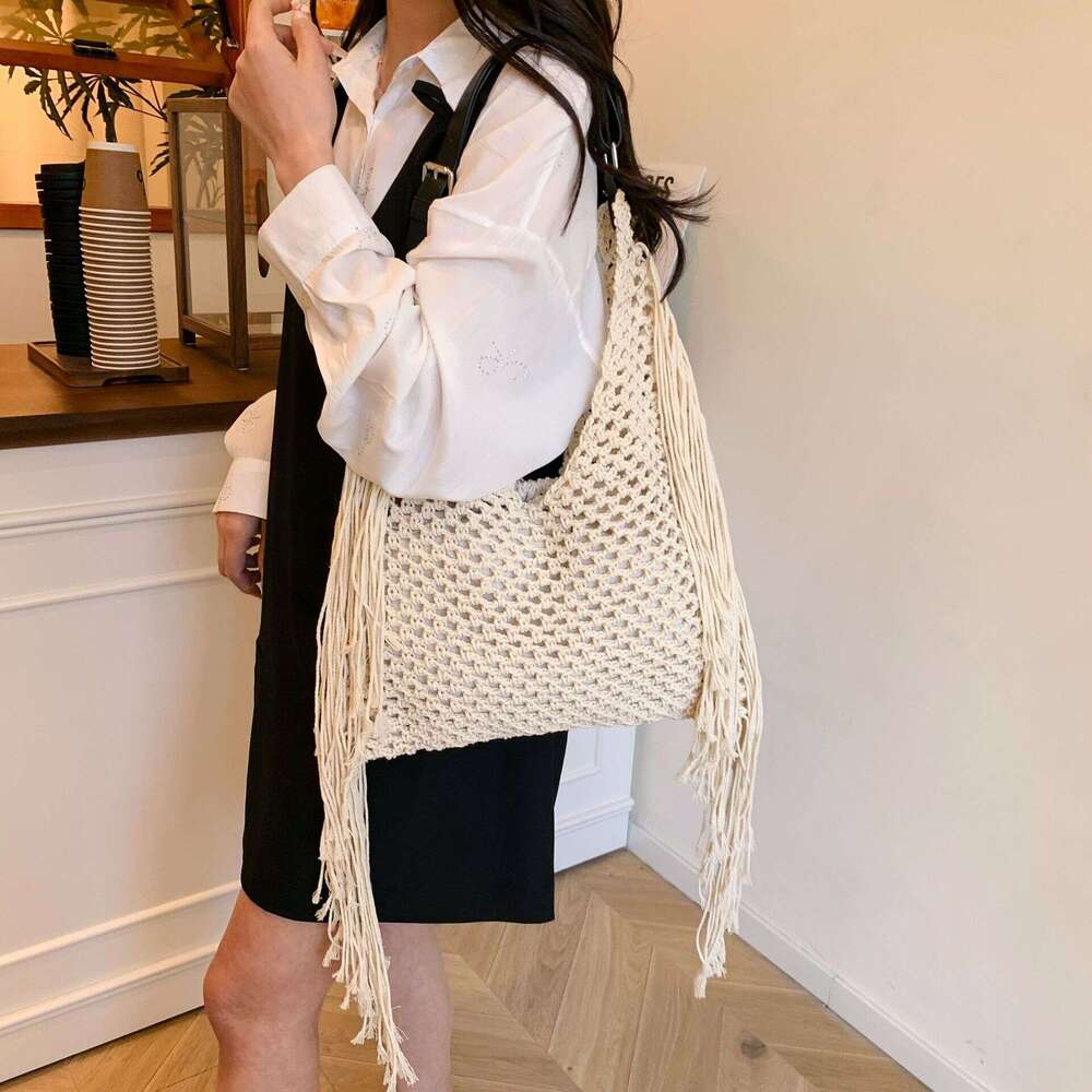 Outdoor Beach Bag Brown and yellow hand woven shoulder bag with tassel decoration and hollowed out handbag for summer fashion and casual women's 