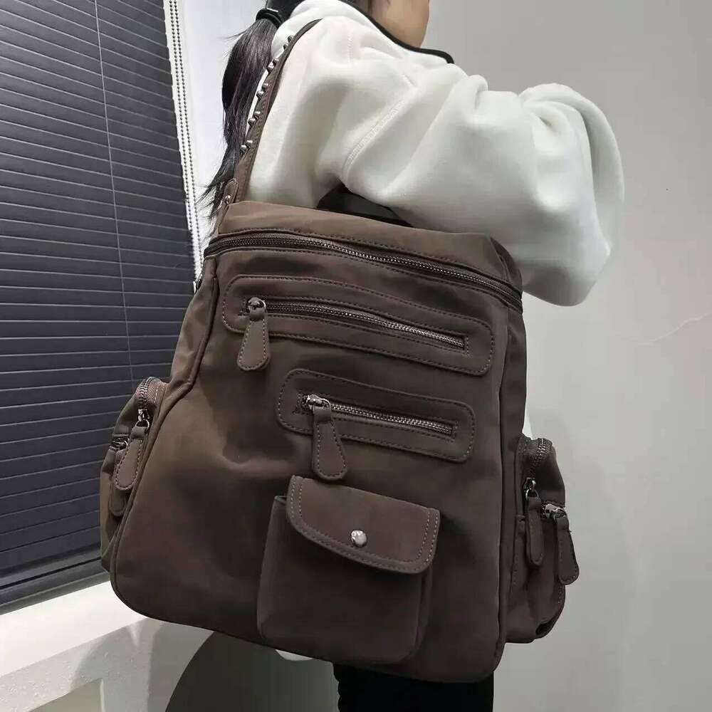 Ladies' Fashionable Frosted Vegan Leather With Large Capacity, Multiple Zippers, Rivets, And A Single Shoulder Bag