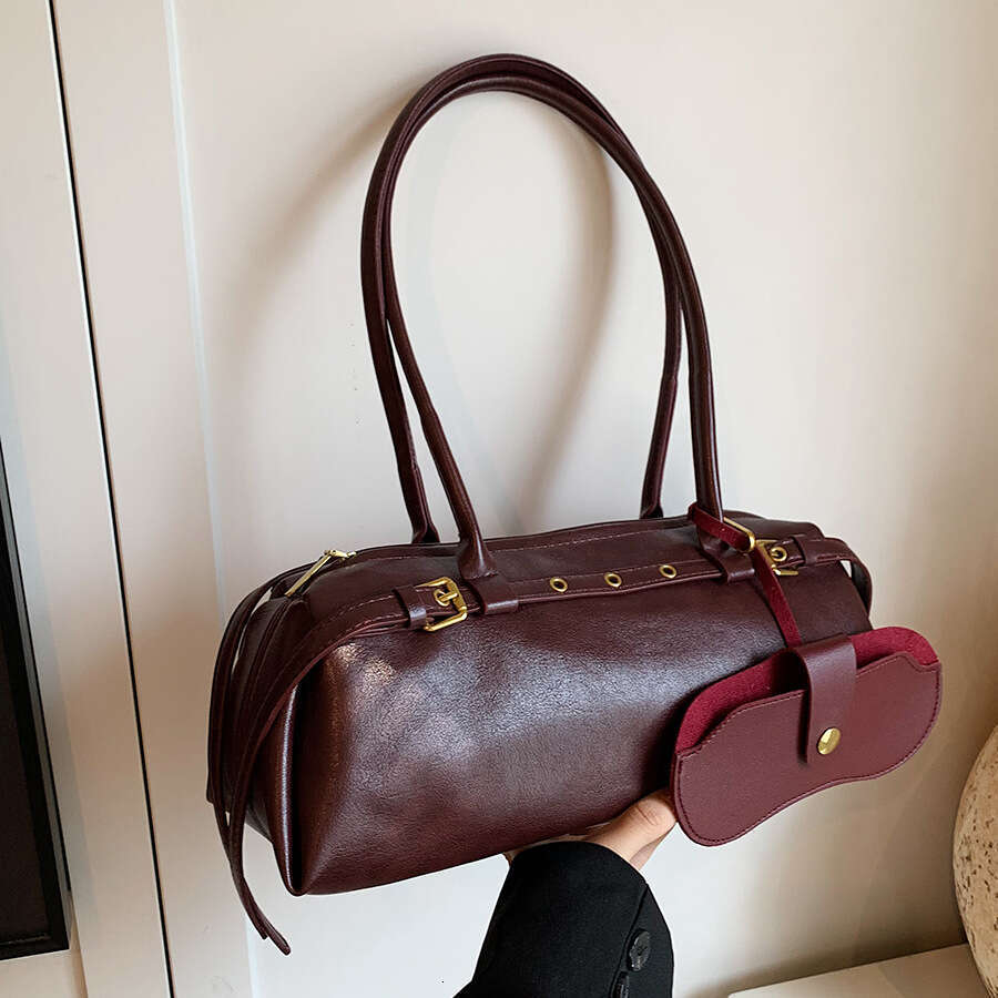 Brown leather hand-held cylindrical bag with metal decoration, single shoulder crossbody bag, fashionable and versatile, women's commuting bag