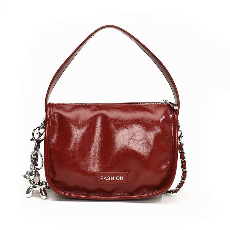Red patent leather chain shoulder bag with fashionable pleated design, crossbody bag versatile for daily street fashion, women's bag