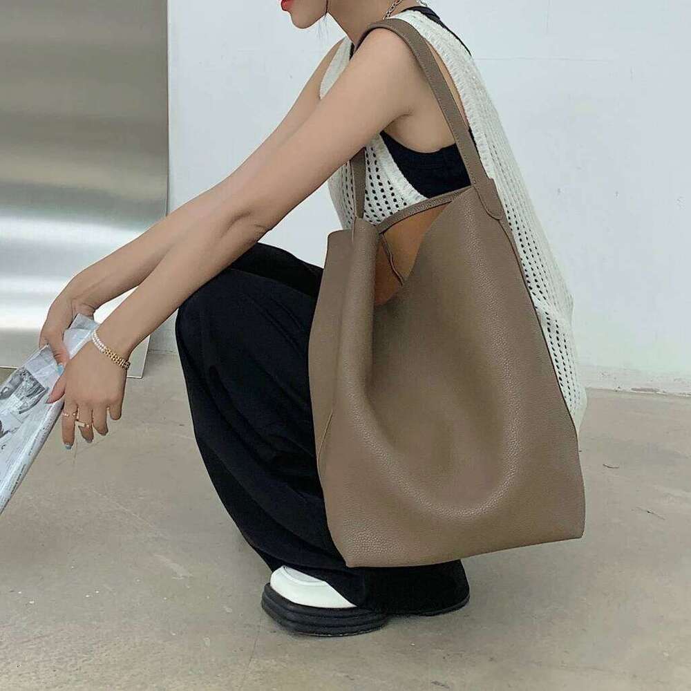 Genuine leather TOT 2025 new classic design cowhide large capacity casual armpit commuting simple ladies shoulder bag