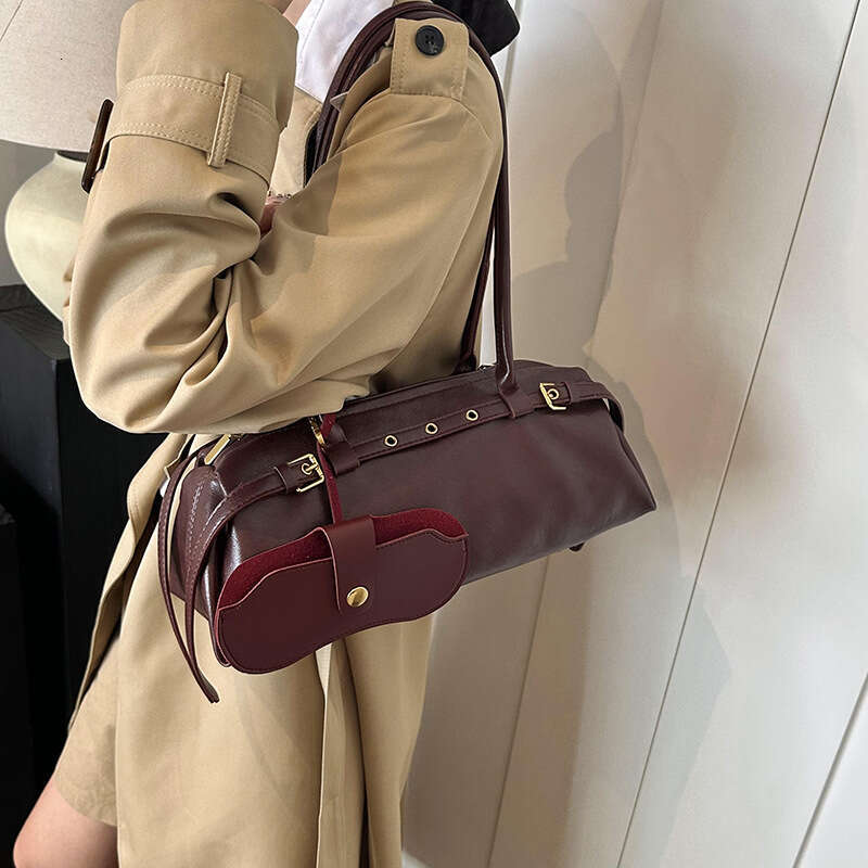 Brown leather hand-held cylindrical bag with metal decoration, single shoulder crossbody bag, fashionable and versatile, women's commuting bag