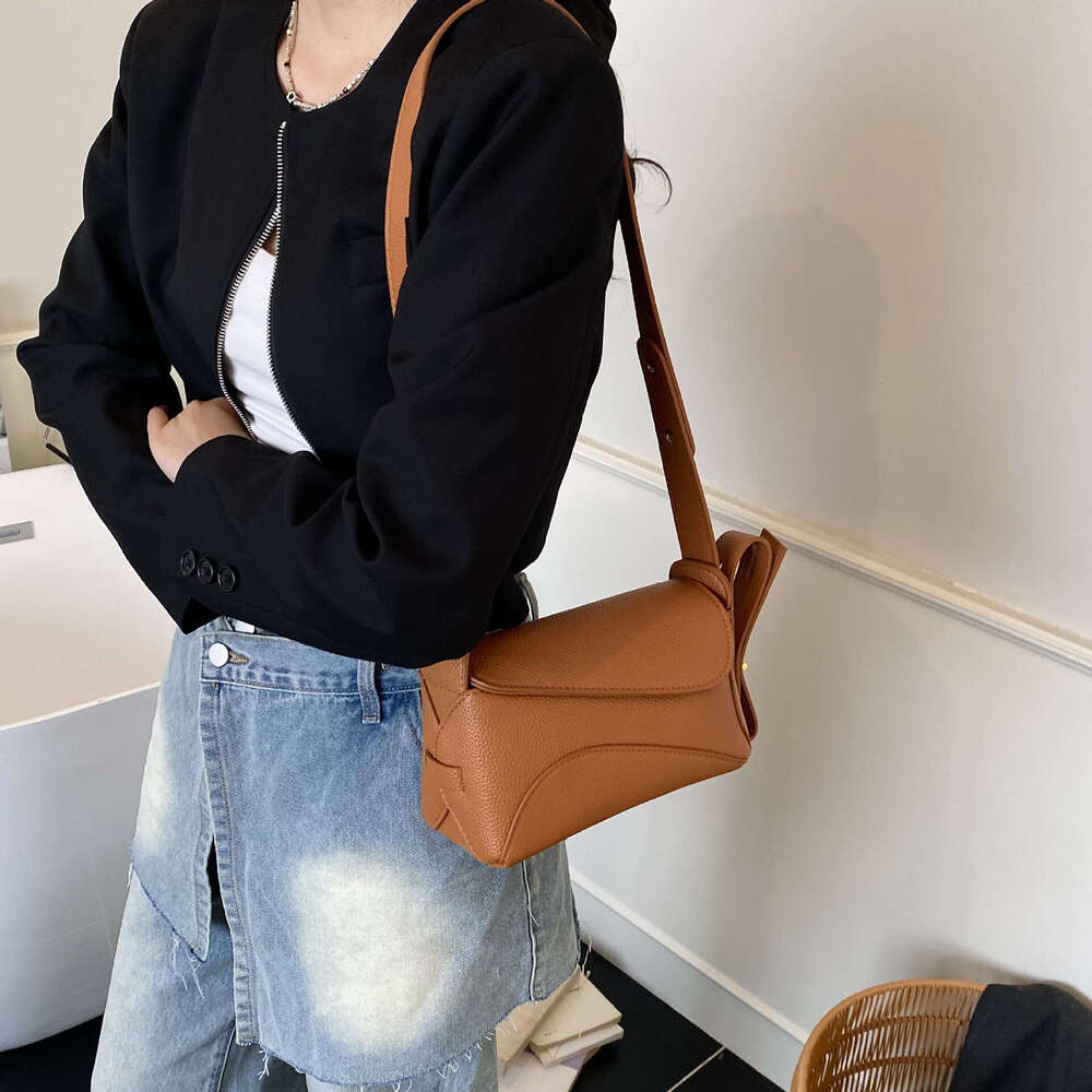 Caramel colored leather single shoulder crossbody bag, simple and fashionable flip cover small bag, versatile for daily commuting, women's bag on