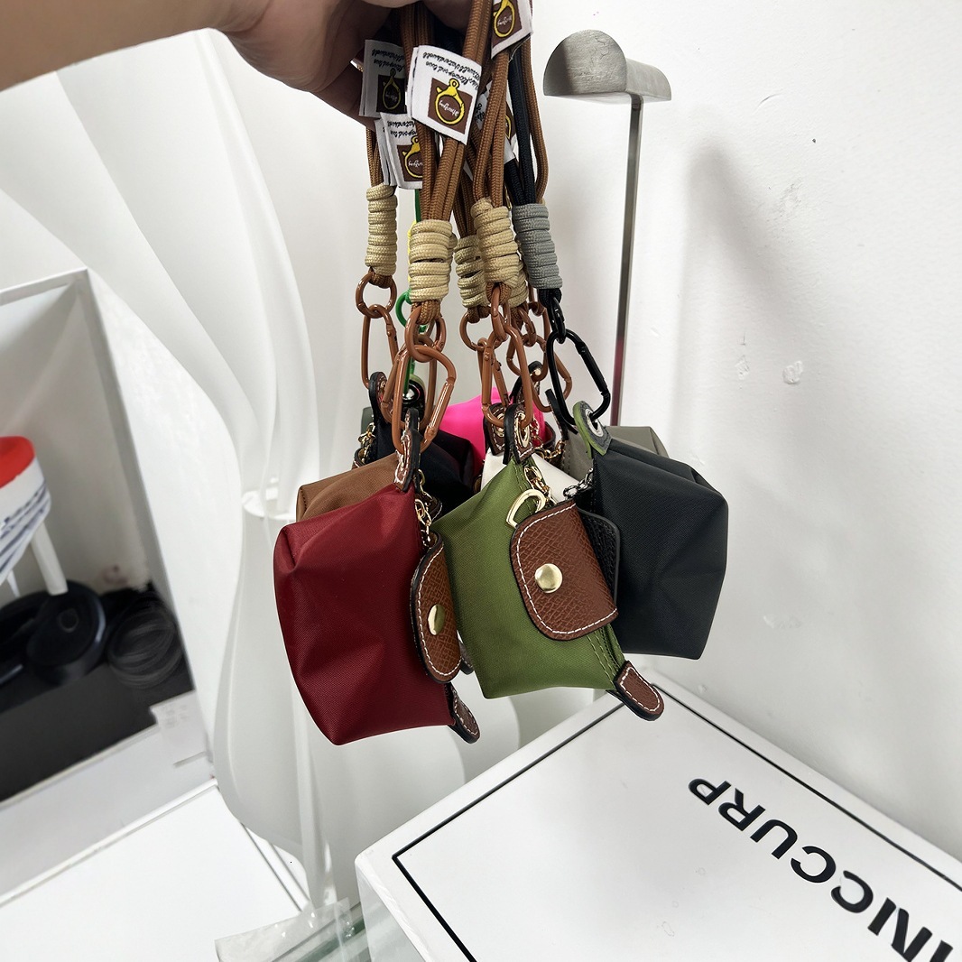 2025S New Model Super Mini Dumpg Bun New French Nylon Leather Change Earphones Lipstick Key Small Pendant Bag