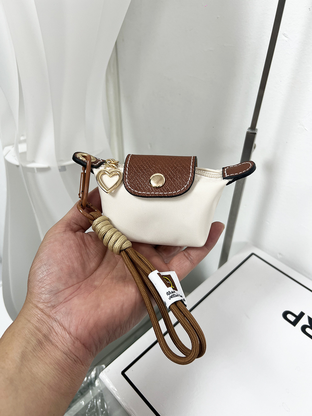 2025S New Model Super Mini Dumpg Bun New French Nylon Leather Change Earphones Lipstick Key Small Pendant Bag
